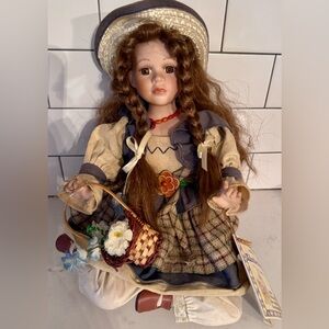 Charming Doll w/ Braided Hair & Floral Outfit
Damage to the straw hat-see photo